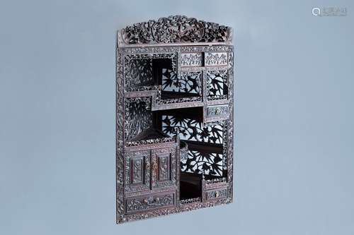 A Chinese carved wooden open worked corner display cabinet w...