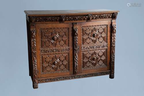 An oak wooden buffet dresser with floral design and lion hea...