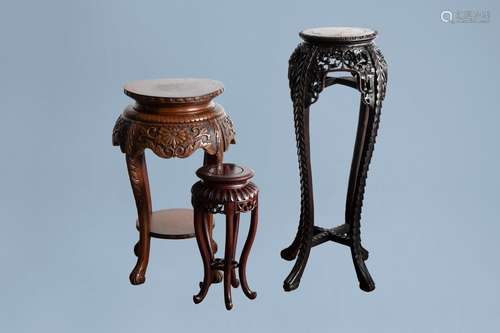 Three Chinese wood stands, one with marble top, 20th C.