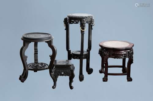 Four Chinese wood stands, one with a marble top, 20th C.