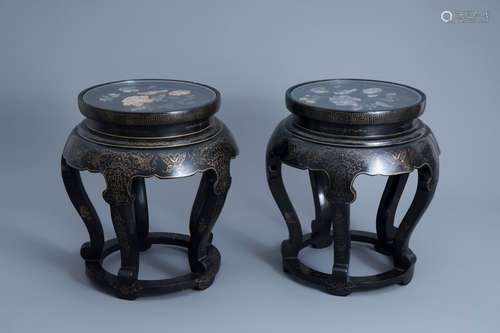 A pair of Chinese black lacquered wooden stands with a soaps...