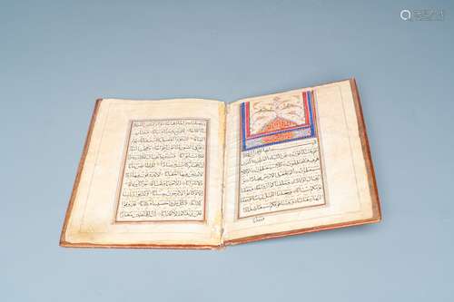 An illuminated Persian manuscript on paper with red leather ...