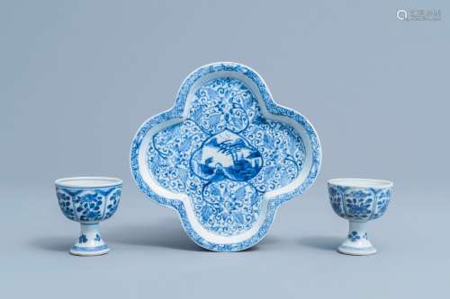 A pair of Chinese blue and white stem cups with floral desig...