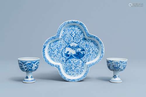 A pair of Chinese blue and white stem cups with floral desig...