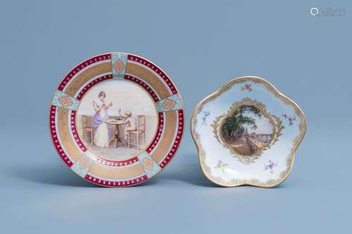 Two polychrome and gilt porcelain saucers with a veduta and ...