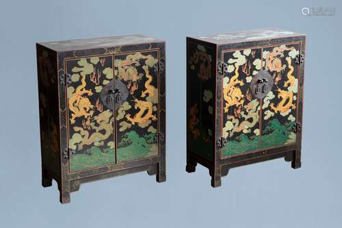 A pair of Chinese black lacquered wooden 'dragons chasing th...