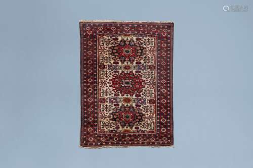 A Turkish rug with floral design, wool on cotton, mid 20th C...