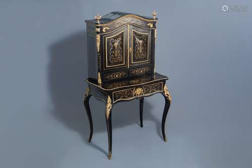 A French ebonised wooden brass inlaid and gilt bronze mounte...