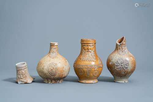 Three German stoneware bellarmine jugs and a neck fragment, ...