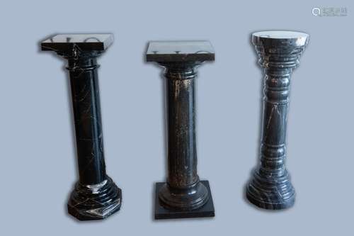 Three grey and black marble pedestals, 20th C.