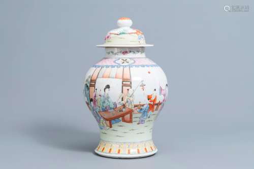 A Chinese famille rose vase and cover with figures on a terr...