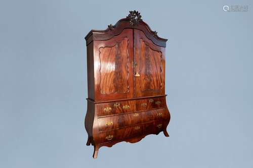 A Dutch veneered wooden two-door cabinet with four drawers, ...