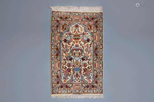 An Oriental prayer rug with birds, antiquities and floral de...