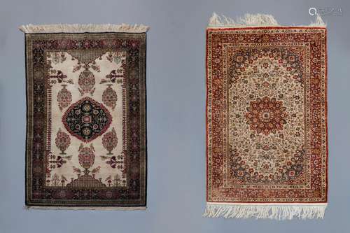 Two Oriental rugs with floral design, birds and a central me...