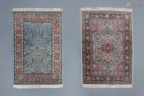 Two Oriental rugs with floral design, silk on cotton, 20th C...