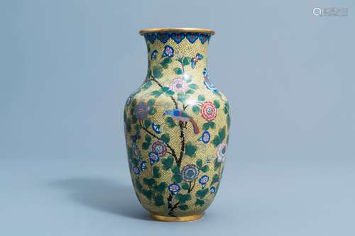 A Chinese cloisonne vase with a bird and butterflies among b...