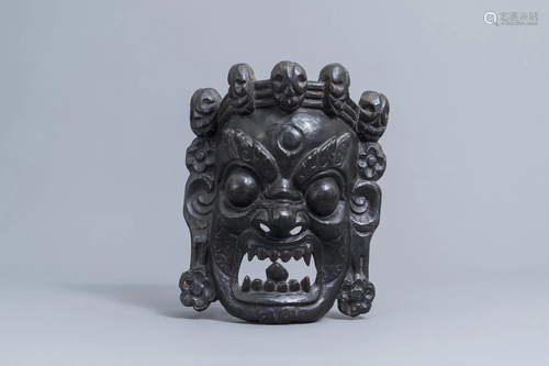 A Tibetan black lacquered carved wooden 'Mahakala'