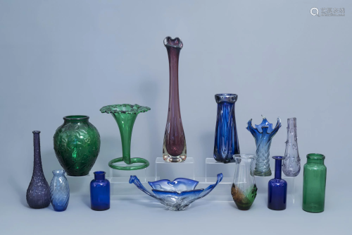 A varied collection of twelve vases and a charger in