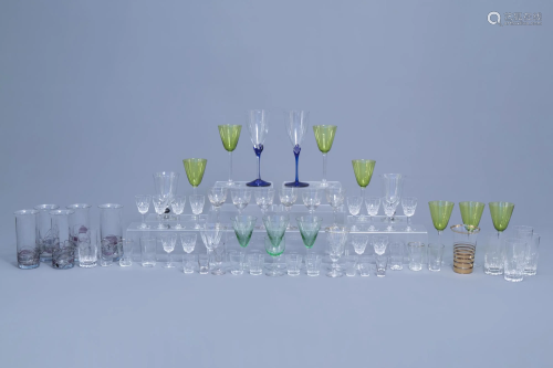 A large and varied collection of drinking glasses,
