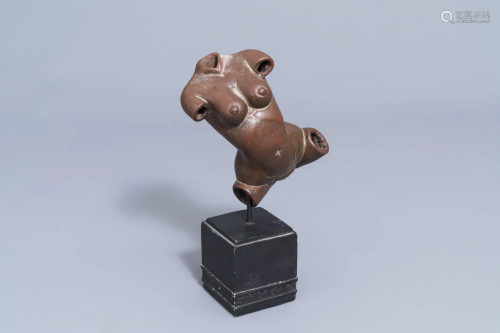 An Indian patinated copper fertility figure with text,