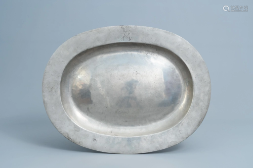 A large monogrammed pewter charger, probably France,