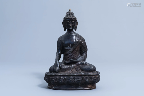 A Sino-Tibetan bronze figure of Buddha, 20th C.