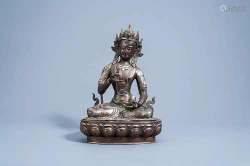 A Sino-Tibetan partly silver plated copper figure of