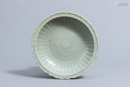 A Chinese lotus shaped Longquan celadon charger with