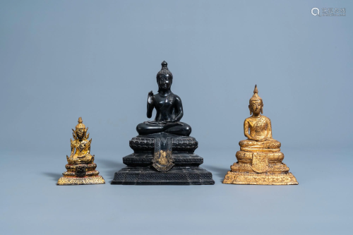 Three gilt and patinated bronze figures of Buddha,