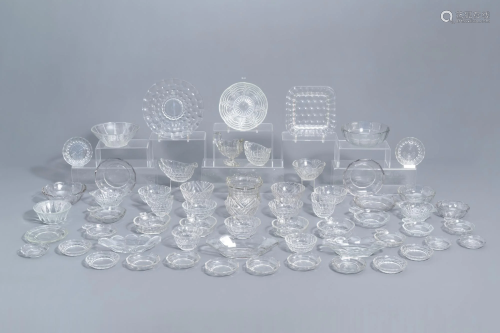 A large and varied collection of clear glass items,