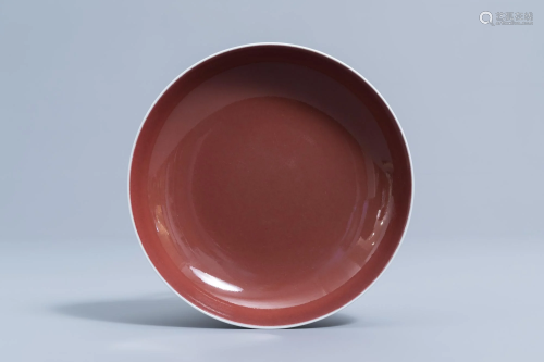 A Chinese monochrome red saucer dish, Qianlong mark,