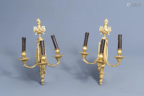 A pair of French Louis XVI three-branch ormolu wall