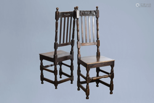 A pair of English wooden chairs with putti supporting a