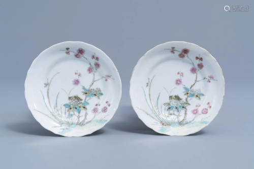 A pair of Chinese famille rose saucers with a
