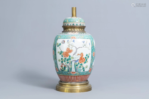 A Chinese famille verte vase and cover with floral