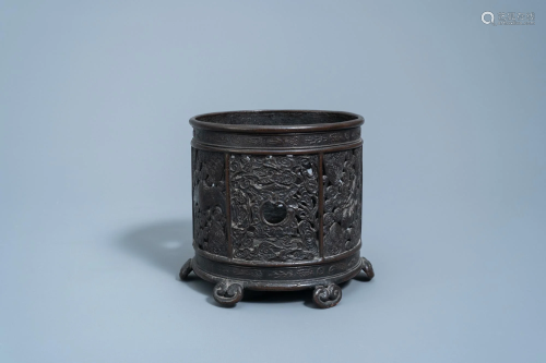 An inscribed Chinese reticulated bronze brush pot, Ming