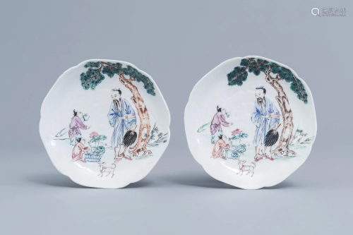 A pair of Chinese famille rose lotus shaped saucers