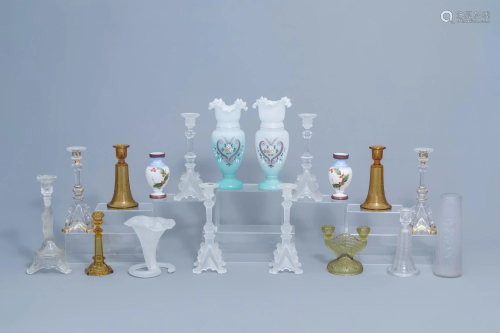 A varied collection of glass candlesticks and vases,