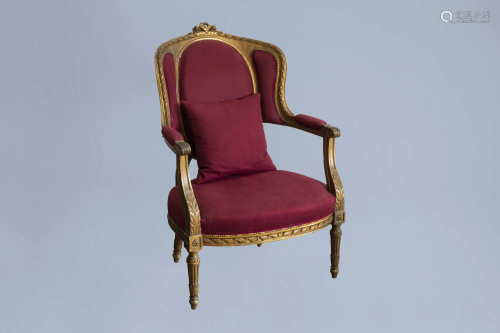 A French Louis XVI style gilt wood armchair with red