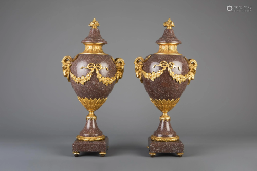 An imposing pair of gilt bronze mounted red porphyry