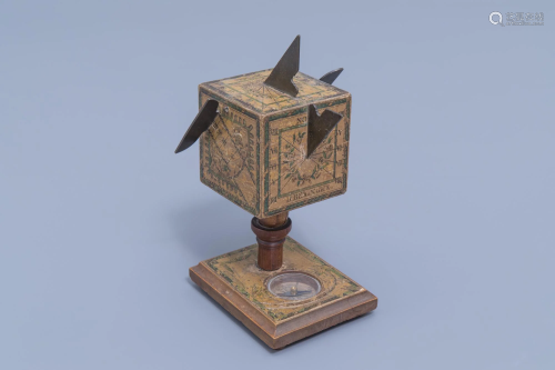 A German wood, brass and paper polyhedral portable cube