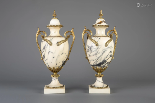 A pair of gilt bronze mounted Calacatta marble