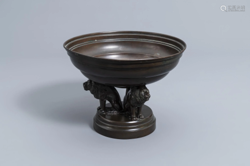 A French bronze and copper bowl resting on three lions,