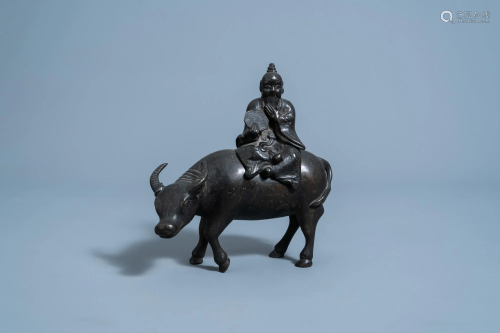 A Chinese bronze 'scholar on buffalo' censer and cover,