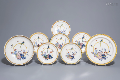 Eight Dutch Delft polychrome chargers and plates with a