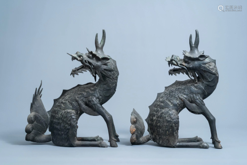 A pair of Chinese bronze models of qilins, Ming