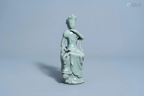 A Chinese longquan celadon glazed figure of a