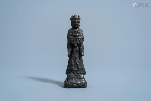 A Chinese bronze figure of a standing official, Ming