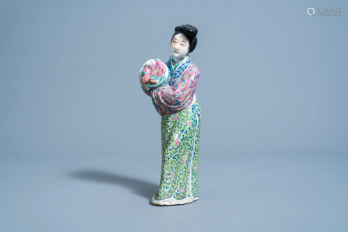 A Chinese famille rose figure of a flower lady,