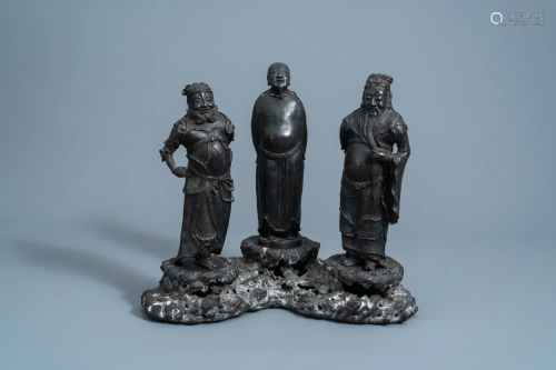 A Chinese bronze group of three figures, seal mark,